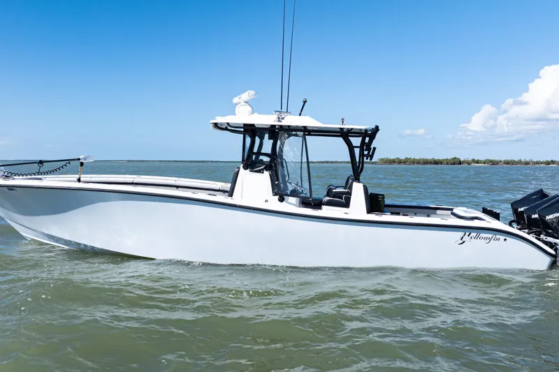 The Image of 2019 Yellowfin 36 Offshore boat with triple Mercury engines on open water. - 0