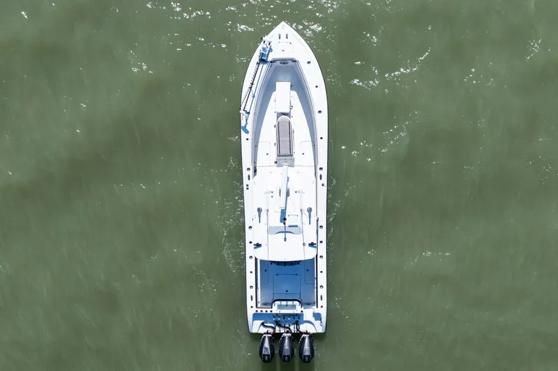 Slide: The Image of Aerial view of 2019 Yellowfin 36 Offshore boat on green water. - 10