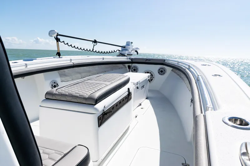Slide: The Image of 2019 Yellowfin 36 Offshore boat interior with seating and ocean view. - 11