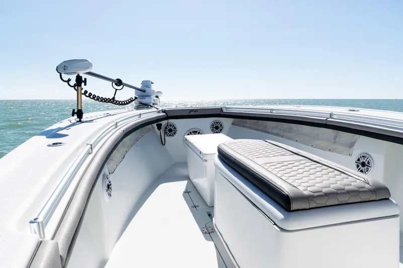 Slide: The Image of 2019 Yellowfin 36 Offshore boat interior with seating, ocean view, and clear sky. - 14