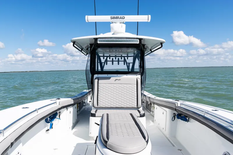 Slide: The Image of 2019 Yellowfin 36 Offshore boat on open water, featuring sleek design and comfortable seating. - 16