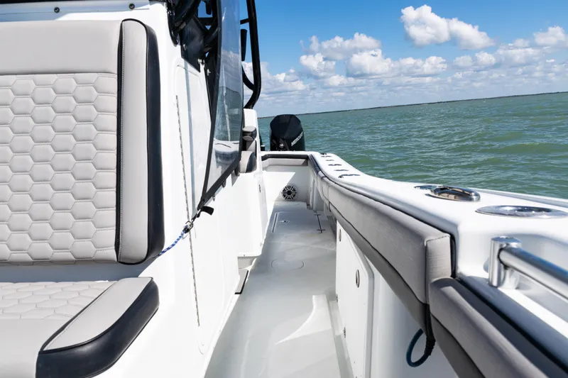 Slide: The Image of 2019 Yellowfin 36 Offshore boat interior with hexagonal seat pattern, ocean view. - 19
