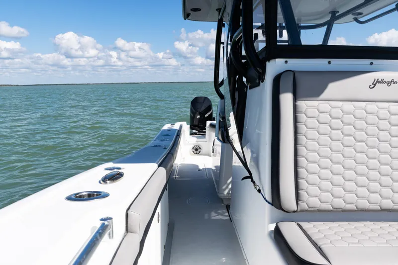 Slide: The Image of 2019 Yellowfin 36 Offshore boat on open water, featuring sleek seating and modern design. - 20