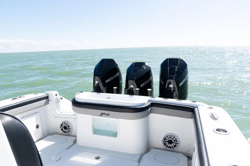 Slide: The Image of 2019 Yellowfin 36 Offshore boat with triple Mercury engines on open sea. - 31