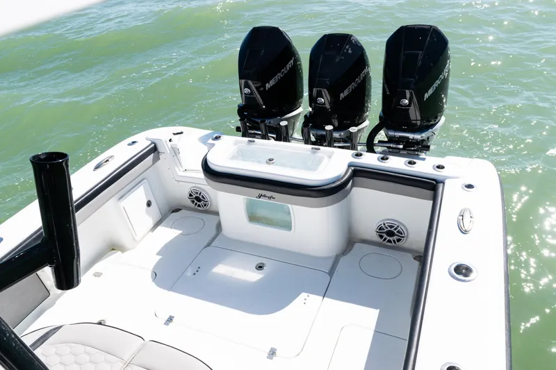Slide: The Image of 2019 Yellowfin 36 Offshore boat with triple Mercury engines on open water. - 32