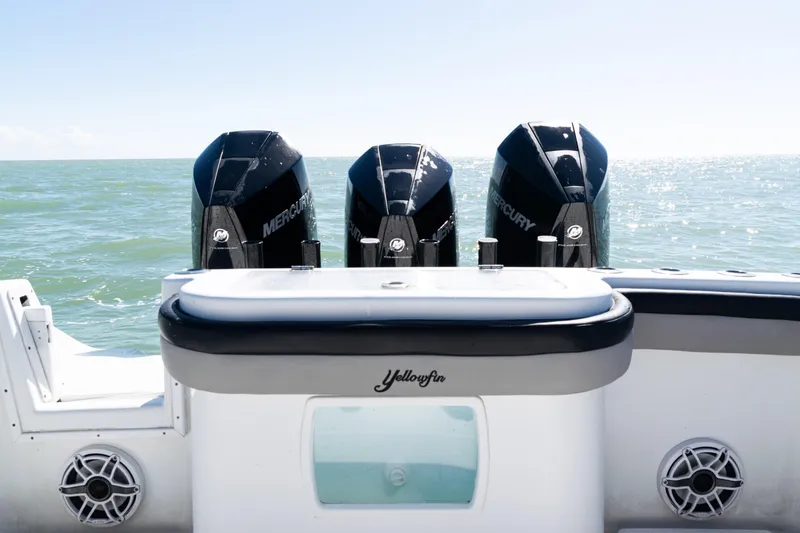Slide: The Image of 2019 Yellowfin 36 Offshore boat with triple Mercury engines on open sea. - 33