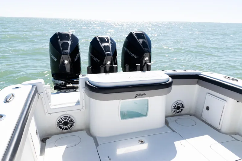 Slide: The Image of 2019 Yellowfin 36 Offshore boat with triple Mercury engines on open sea. - 34