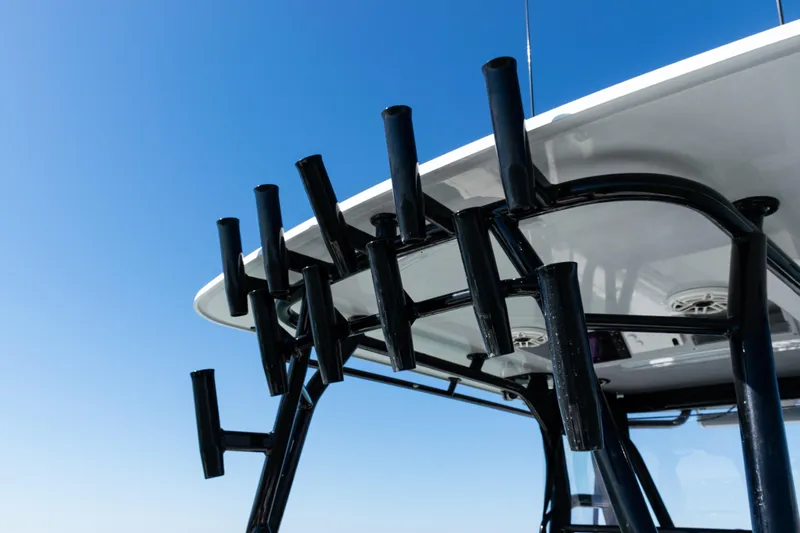 Slide: The Image of 2019 Yellowfin 36 Offshore boat with rod holders against clear blue sky. - 39