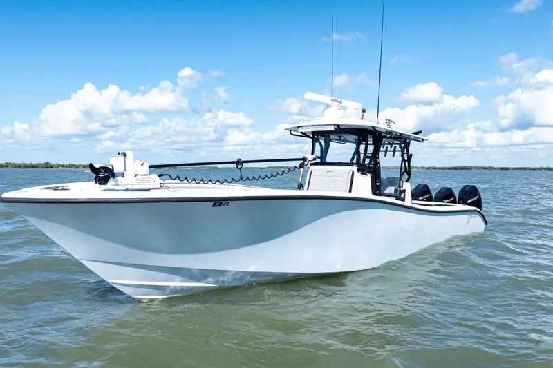 Slide: The Image of 2019 Yellowfin 36 Offshore boat on open water under blue sky. - 4