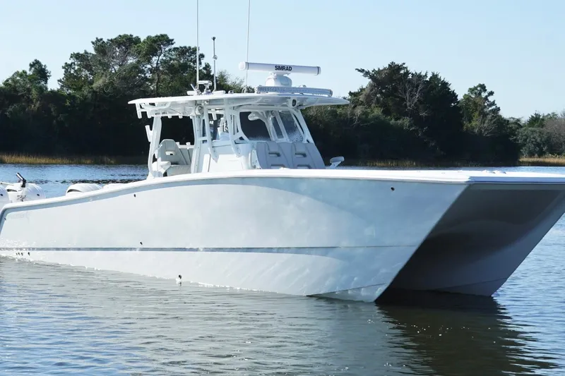 Slide: The Image of 2024 Freeman 38 boat on calm water, showcasing sleek design and modern features. - 10