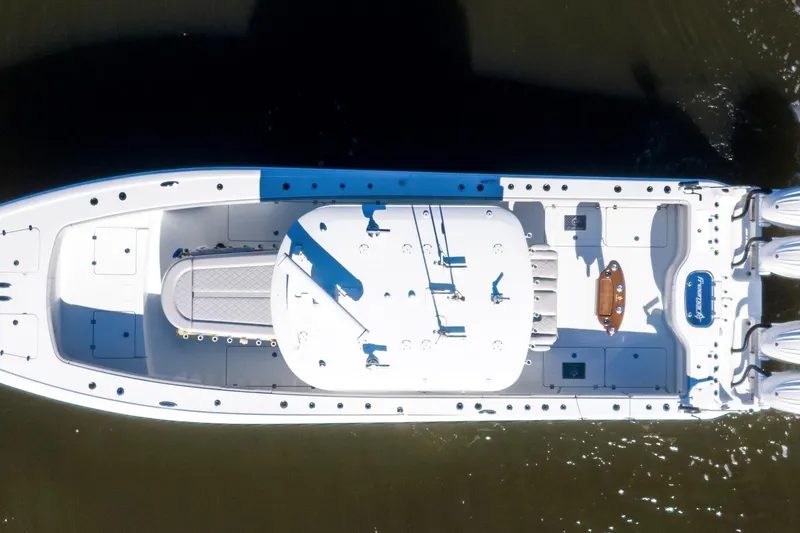 Slide: The Image of Aerial view of 2024 Freeman 38 boat on water, showcasing sleek design and powerful engines. - 13