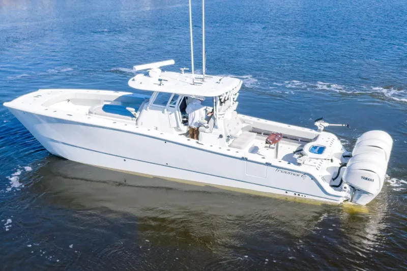 Slide: The Image of 2024 Freeman 38 boat on water with dual Yamaha engines. - 4