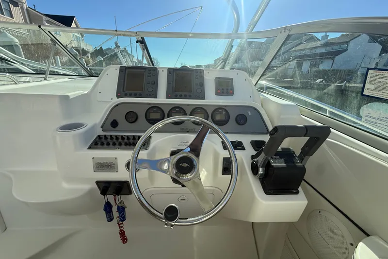 Slide: The Image of Helm of 2002 Wellcraft 290 Coastal boat with steering wheel and control panel. - 20