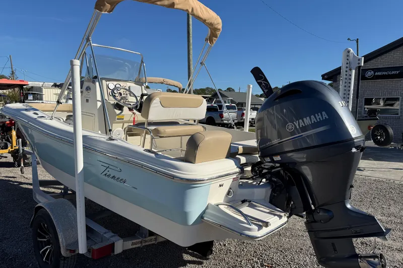Slide: The Image of 2016 Pioneer 180 Islander boat with Yamaha outboard motor on a trailer. - 7