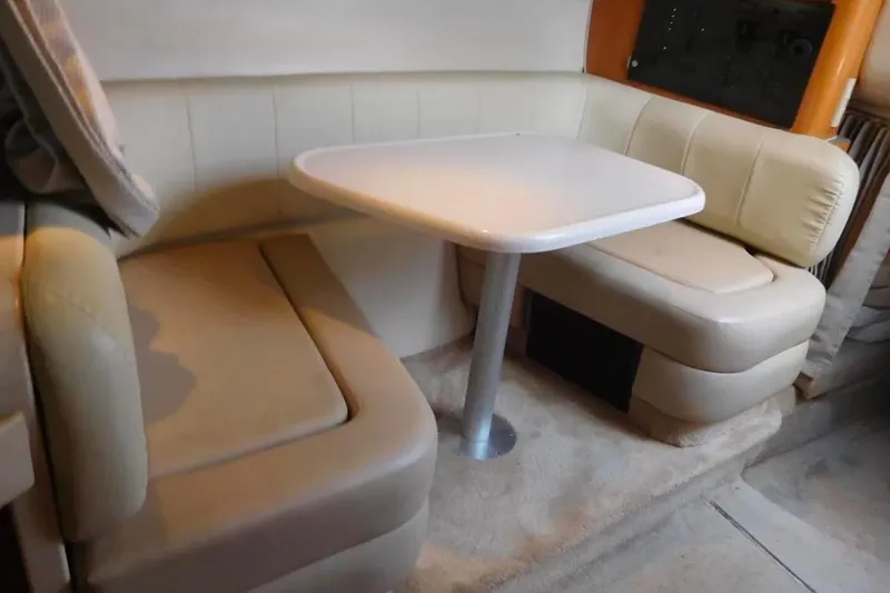 Slide: The Image of 2001 Regal Commodore 2960 interior with beige seating and dining table. - 11