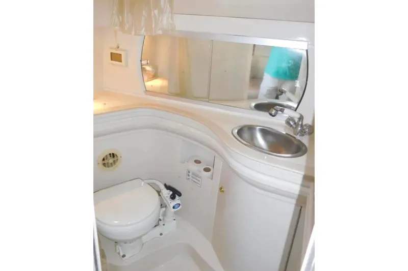 Slide: The Image of Bathroom interior of 2001 Regal Commodore 2960 boat with sink and toilet. - 21