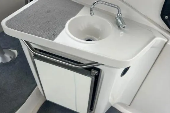 Slide: The Image of Compact sink and counter area on 2001 Regal Commodore 2960 boat. - 3
