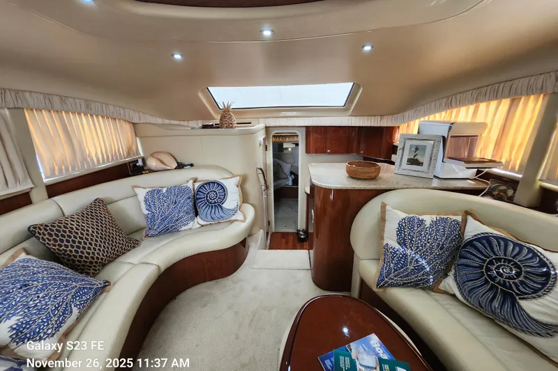 Slide: The Image of Luxurious interior of a 2004 Sea Ray 390 Motor Yacht with elegant seating and decor. - 24