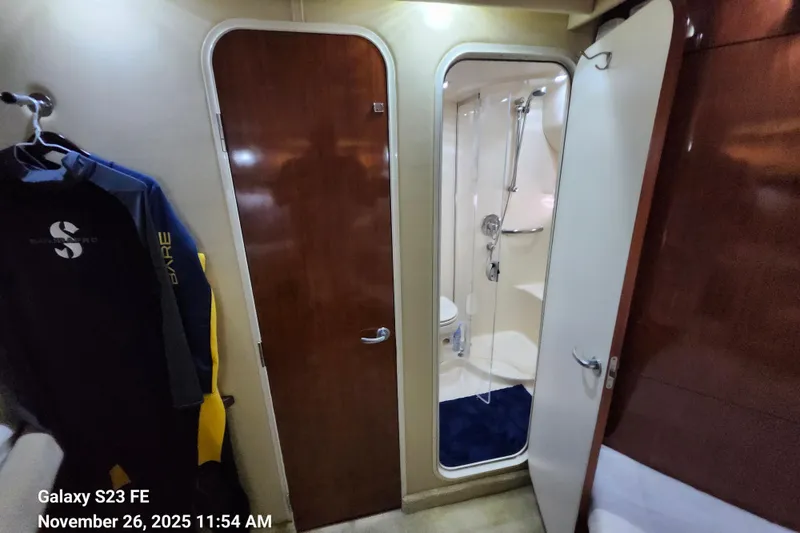 Slide: The Image of Interior of 2004 Sea Ray 390 Motor Yacht showing guest cabin entry to guest/day head and shower. - 30