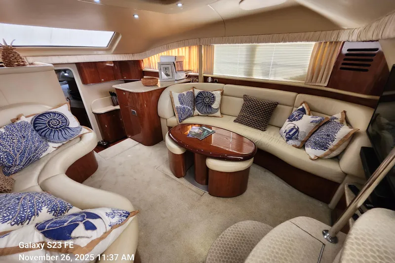 Slide: The Image of Luxurious interior of 2004 Sea Ray 390 Motor Yacht with elegant seating and decor. - 48
