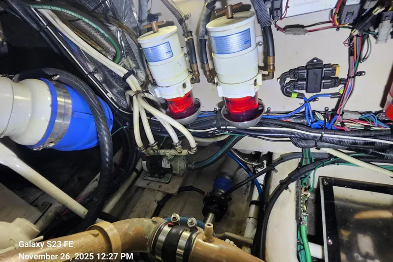 Slide: The Image of Engine room of 2004 Sea Ray 390 Motor Yacht with fuel filters and wiring. - 53