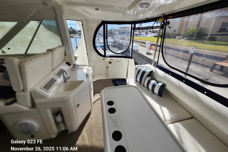 Slide: The Image of Bar and seating behind helm station. View also shows entryway to the boat on the starboard side. - 62