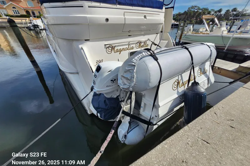 Slide: The Image of 2004 Sea Ray 390 Motor Yacht docked with inflatable boat attached. - 63