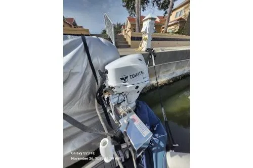 Slide: The Image of 2024 Tohatsu outboard motor on a docked 2004 Sea Ray 390 Motor Yacht. - 68