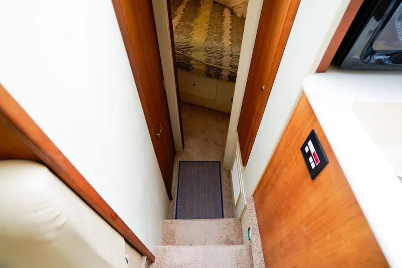 Slide: The Image of Interior view of 2002 Silverton 352 Motor Yacht, showing stairs and cabin entrance. - 39