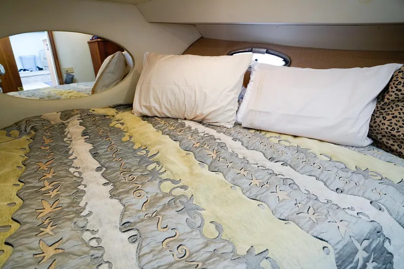 Slide: The Image of Cozy bedroom in 2002 Silverton 352 Motor Yacht with decorative bedding and pillows. - 44