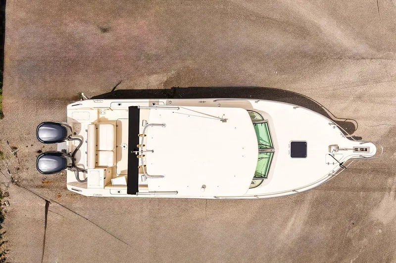 Slide: The Image of Aerial view of 2005 Pursuit 2670 Denali LS boat on concrete surface. - 5