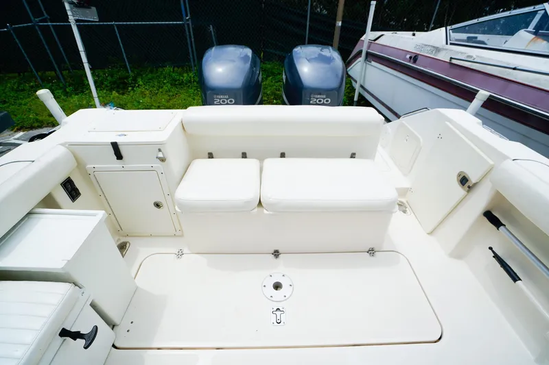 Slide: The Image of 2005 Pursuit 2670 Denali LS boat interior with seating and storage compartments. - 8