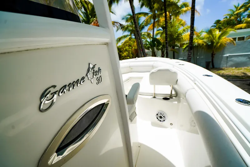 Slide: The Image of 2016 Sea Hunt Gamefish 30 boat bathroom with toilet and sink. - 13