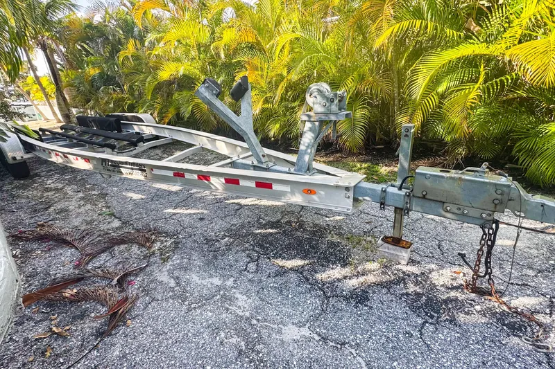 Slide: The Image of Trailer for 2016 Sea Hunt Gamefish 30, parked on a sunny driveway. - 20
