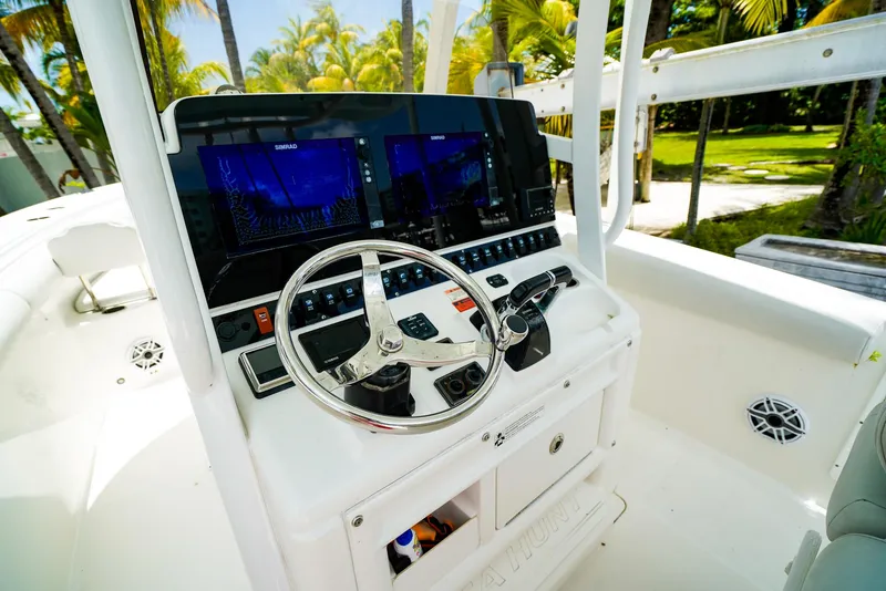 Slide: The Image of 2016 Sea Hunt Gamefish 30 boat cockpit with modern controls and comfortable seating. - 9