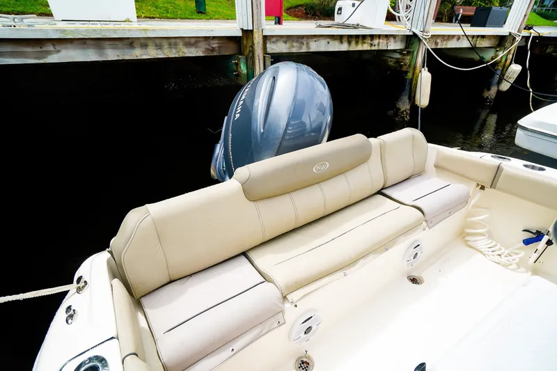 Slide: The Image of 2022 Key West 219 FS boat with beige seating and Yamaha outboard motor. - 5