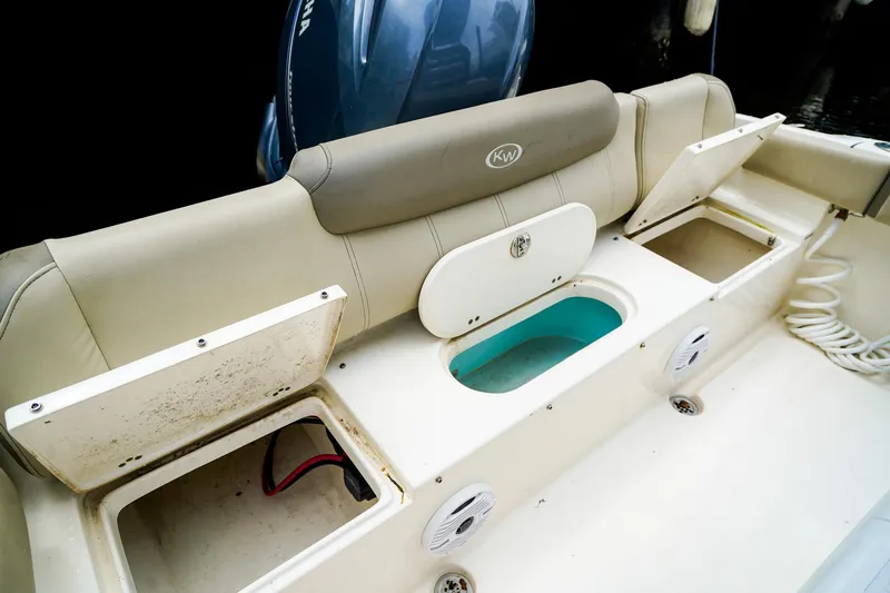 Slide: The Image of 2022 Key West 219 FS boat interior with storage compartments and seating. - 8