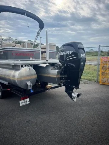 Slide: The Image of 2015 Sun Tracker PARTY BARGE® 24 XP3 with Mercury 200 engine, parked on asphalt. - 3