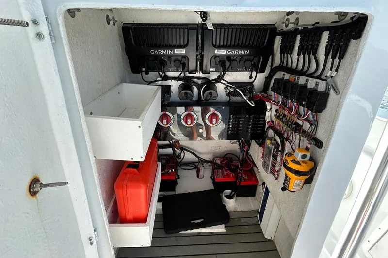 Slide: The Image of 2006 Whitewater 28 boat deck, spacious and clean, docked by a scenic canal. - 14