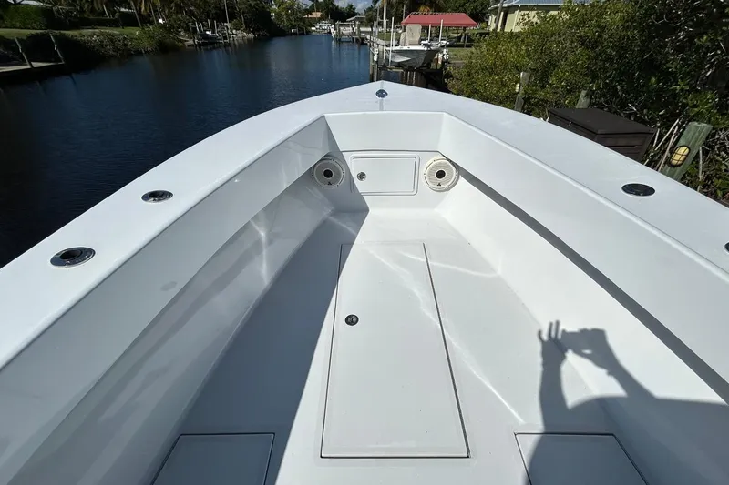 Slide: The Image of Electrical panel inside a 2006 Whitewater 28 boat, featuring Garmin equipment and organized wiring. - 16