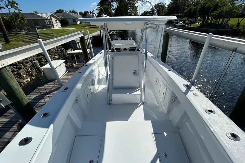 Slide: The Image of 2006 Whitewater 28 boat interior, clean deck, canal view, sunny day. - 17