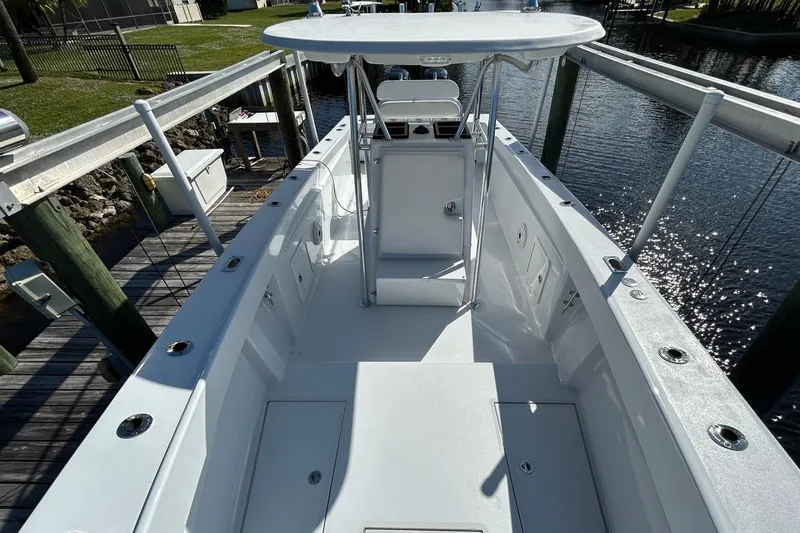 Slide: The Image of 2006 Whitewater 28 boat docked by a serene waterfront. - 18