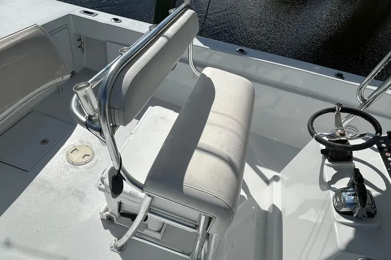 Slide: The Image of 2006 Whitewater 28 boat console with steering wheel and navigation controls. - 6