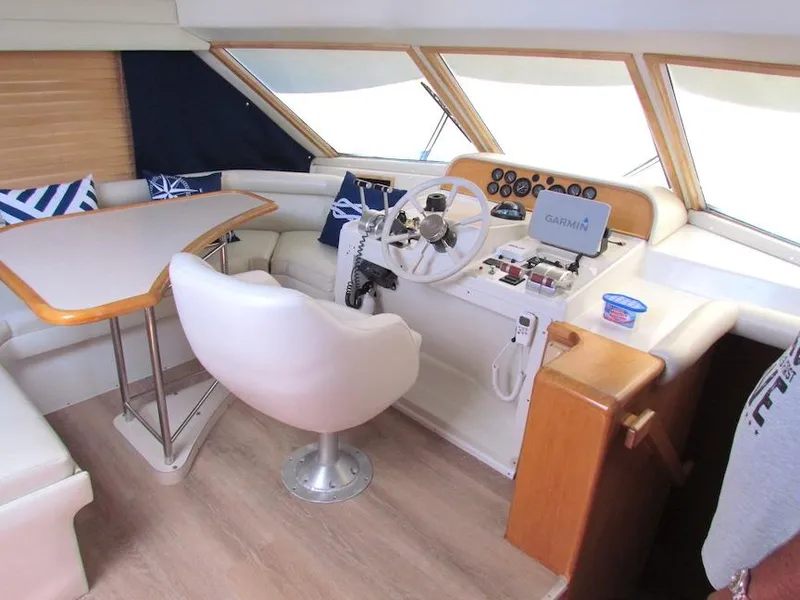 Slide: The Image of Interior of a 1998 Navigator 53 yacht with helm, seating, and navigation equipment. - 20