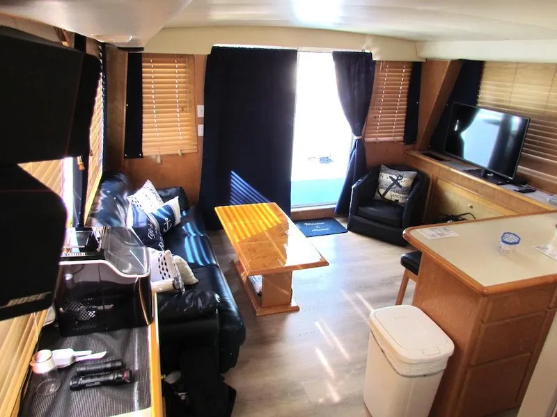 Slide: The Image of Interior of 1998 Navigator 53 yacht with modern furnishings and natural light. - 21