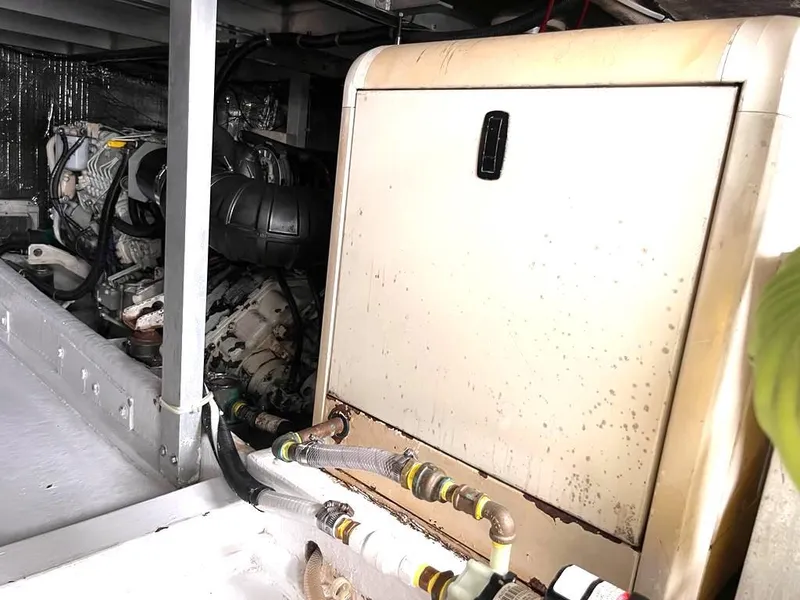 Slide: The Image of Engine room of a 1998 Navigator 53 yacht, featuring machinery and equipment. - 40