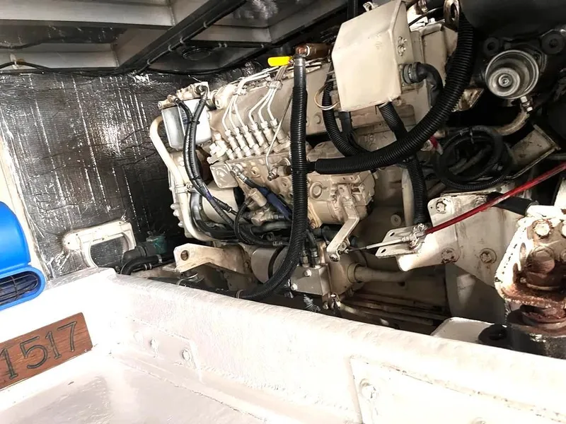 Slide: The Image of Engine compartment of a 1998 Navigator 53 yacht, showcasing mechanical components and wiring. - 46
