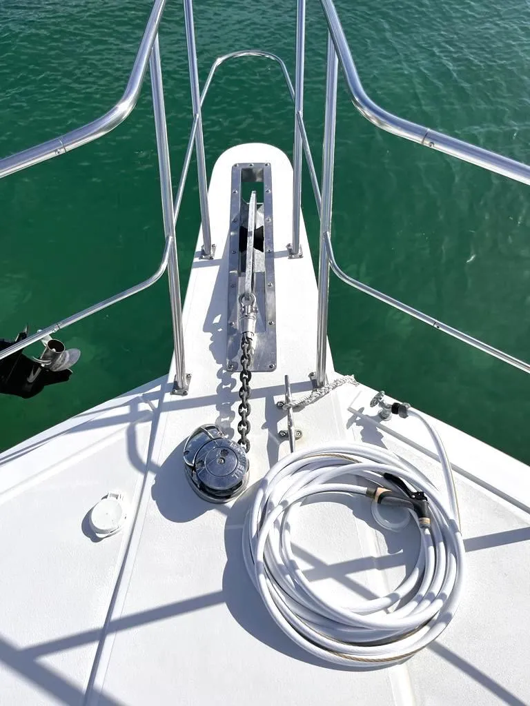 Slide: The Image of Bow of 1998 Navigator 53 yacht with anchor chain and coiled hose. - 6