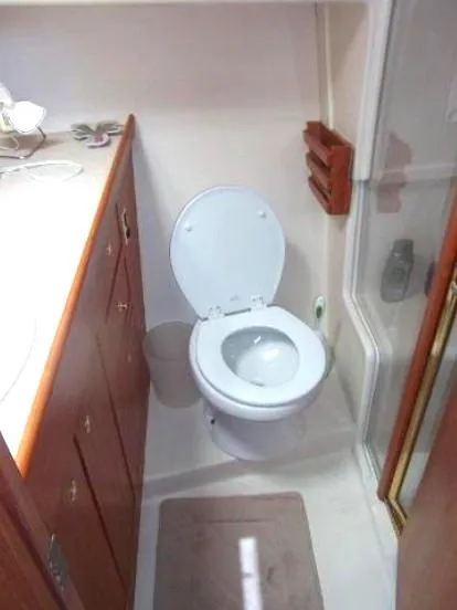 Slide: The Image of Bathroom interior of 2000 Mainship 430 Trawler with toilet and shower. - 10