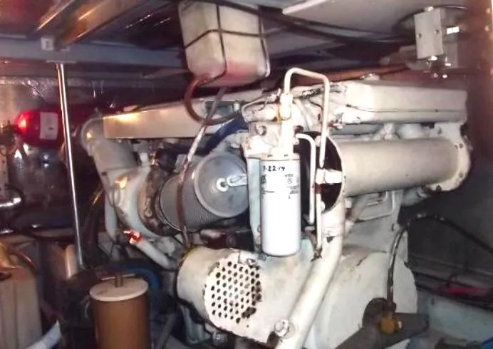 Slide: The Image of Engine room of 2000 Mainship 430 Trawler, showcasing mechanical components and systems. - 19